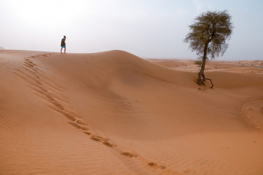 man walking in desert scaled 1